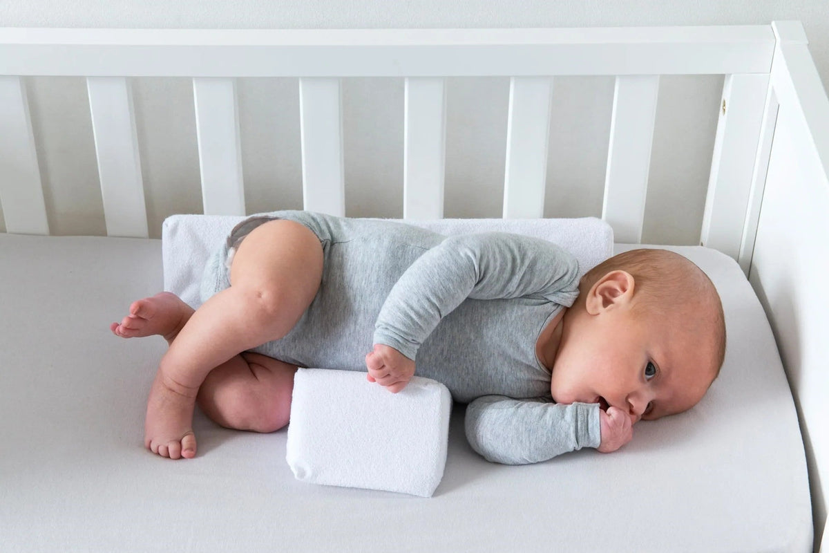 Coussin anti-roulement pour bébé 